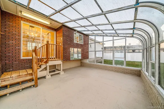 a view of an empty room with a large window