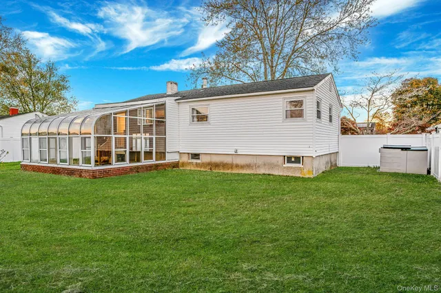 an aerial view of a house with a swimming pool