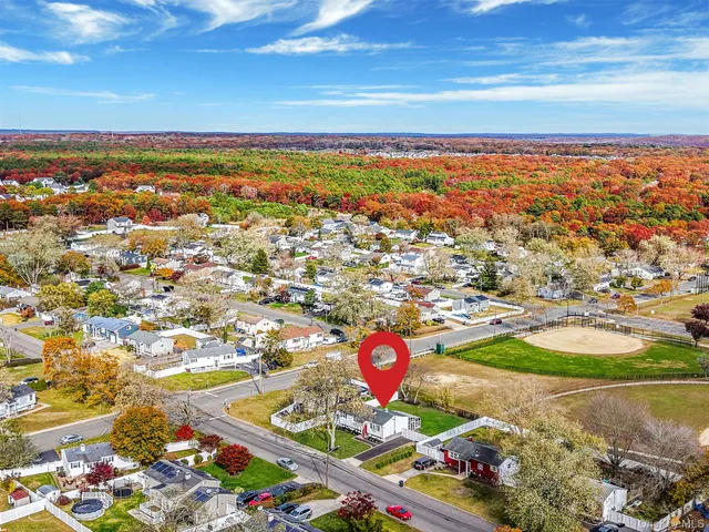 an aerial view of residential houses with outdoor space