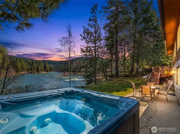 a kitchen with stainless steel appliances granite countertop a stove refrigerator and cabinets