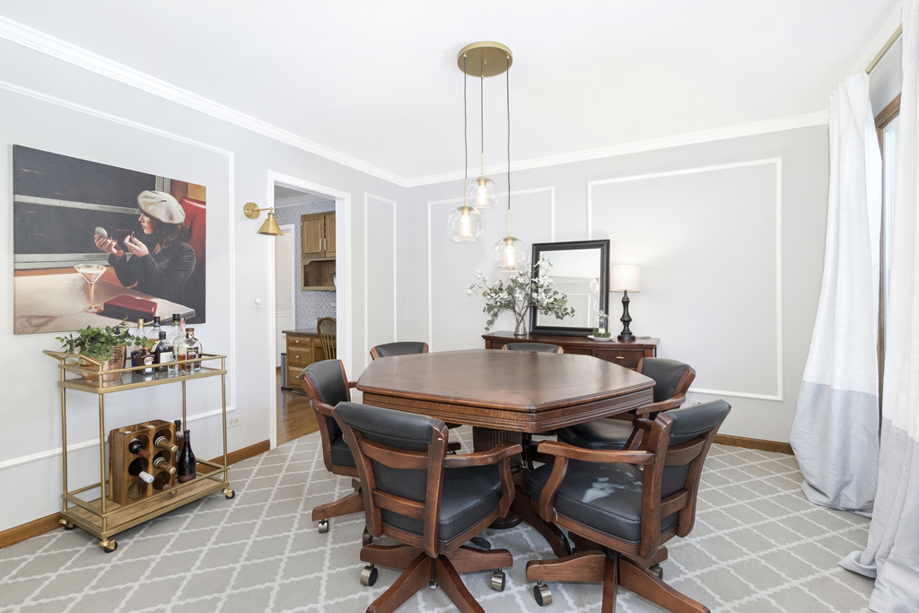 1712 Mundelein Road Naperville, IL 60565 - Photo 13 of 42 a view of a dining room with furniture and chandelier
