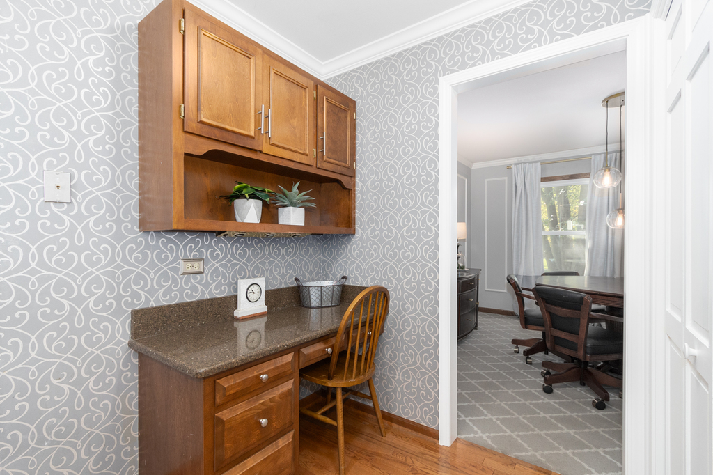 1712 Mundelein Road Naperville, IL 60565 - Photo 15 of 42 a kitchen with a sink cabinets and wooden floor