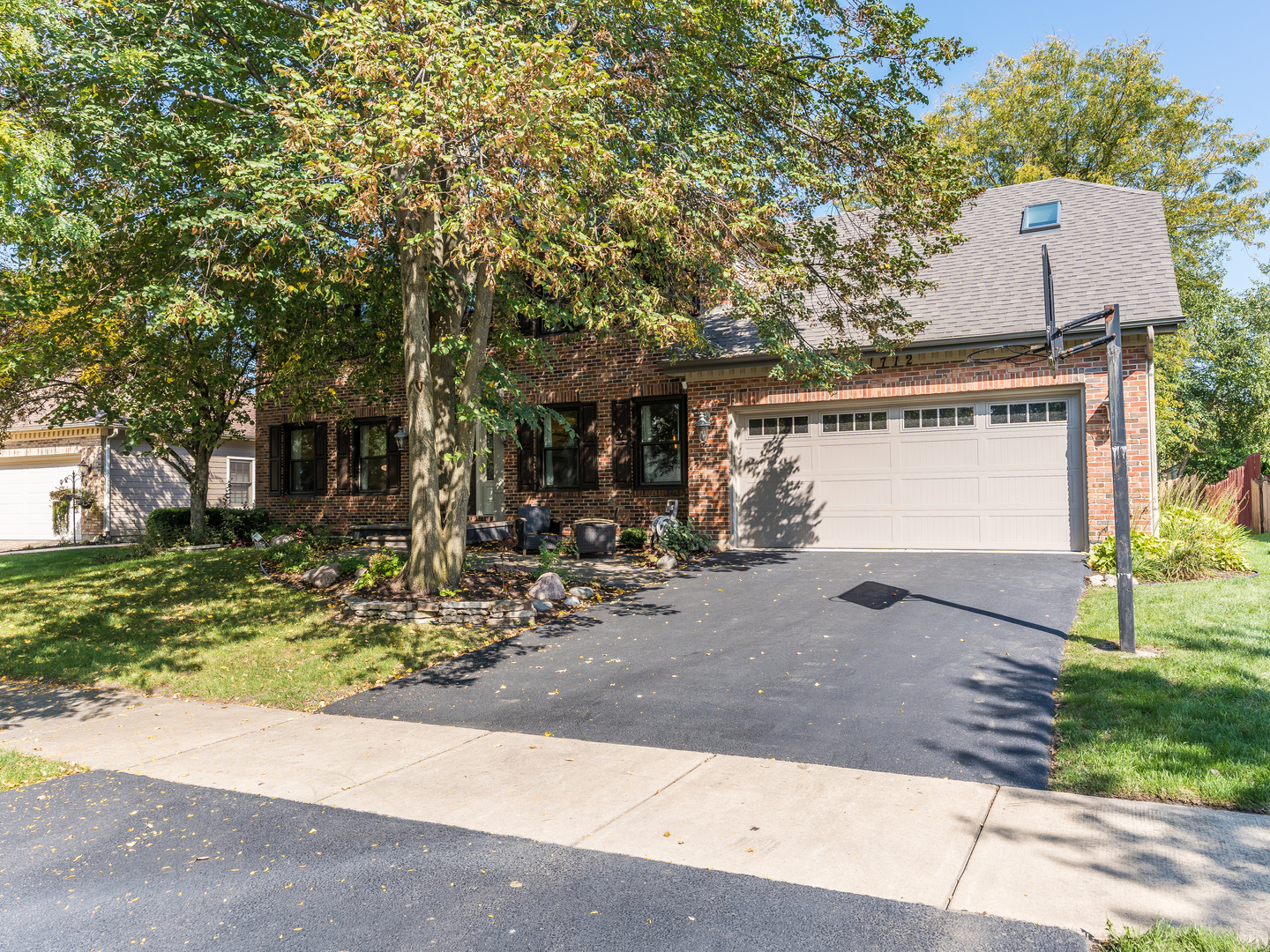 1712 Mundelein Road Naperville, IL 60565 - Photo 2 of 42 a front view of a house with garden