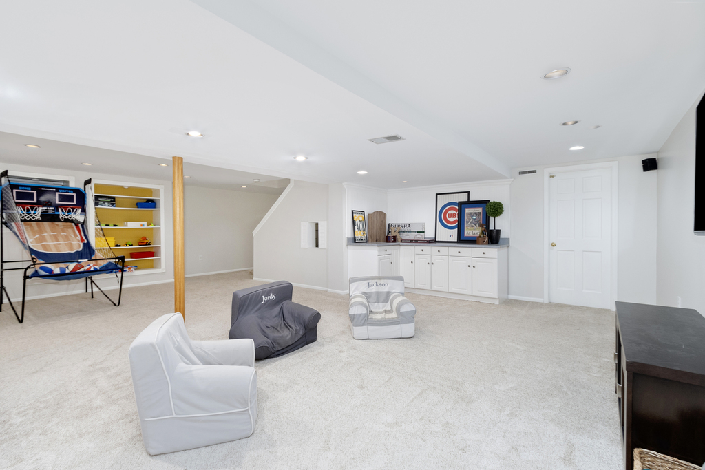 1712 Mundelein Road Naperville, IL 60565 - Photo 32 of 42 a living room with furniture and a couch