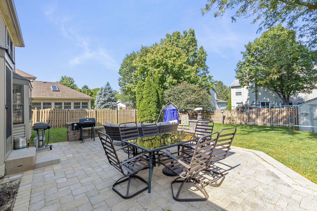 1712 Mundelein Road Naperville, IL 60565 - Photo 35 of 42 a view of a patio with table and chairs and potted plants