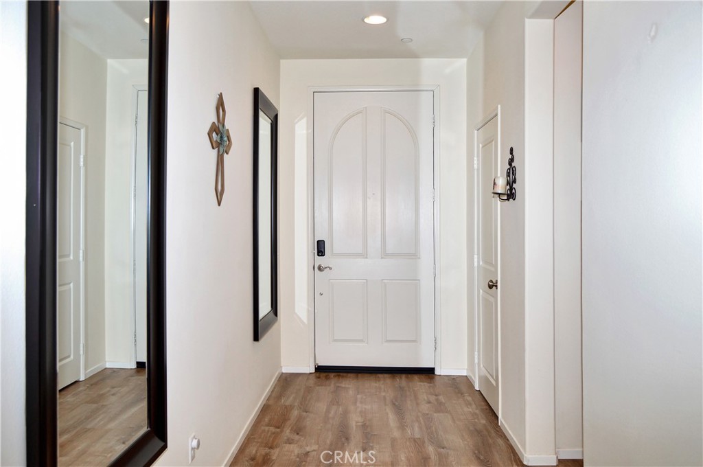 166 Fox Lane Calimesa, CA 92320 - Photo 9 of 76 Entry Hall with Fabulous 3-Year-New Luxury Vinyl Plank Flooring which Continues through the Living Areas, Baths, and Laundry Room