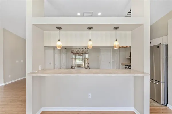 a bathroom with a granite countertop sink a large mirror and a shower