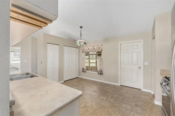a bathroom with a granite countertop sink double and mirror