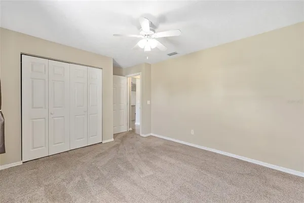 a view of a house with a yard and a garden