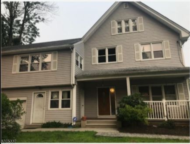 134 Tingley Lane Edison, NJ 08820 - Photo 3 of 10 a front view of a house with garden