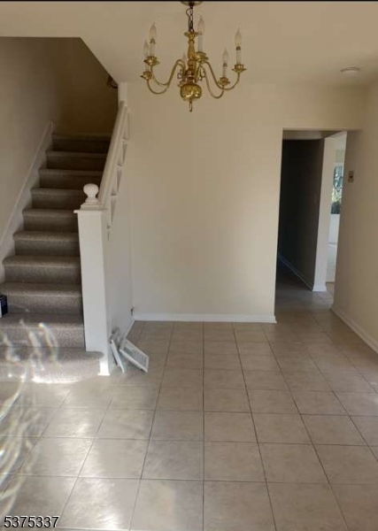 134 Tingley Lane Edison, NJ 08820 - Photo 4 of 10 a view of a room with stairs