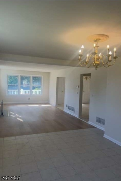 134 Tingley Lane Edison, NJ 08820 - Photo 6 of 10 a view of a hallway with chandelier