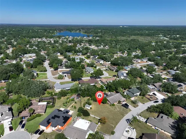 an aerial view of residential houses with city view