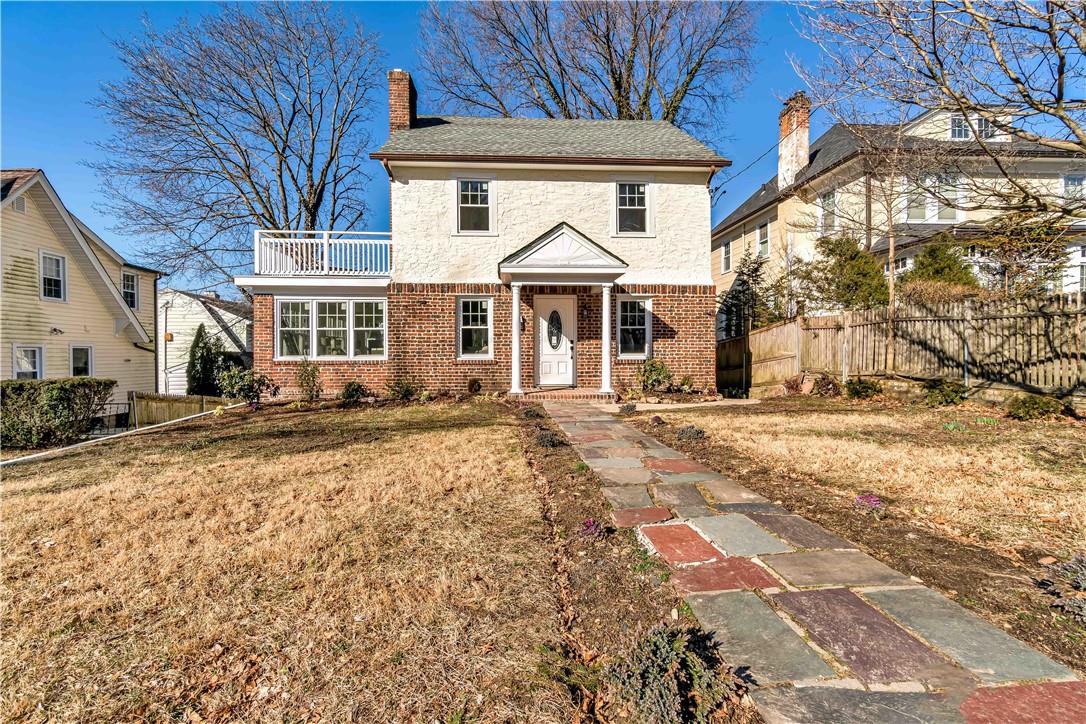 84 Perth Avenue New Rochelle, NY 10804 - Photo 1 of 1 a front view of a house with a yard