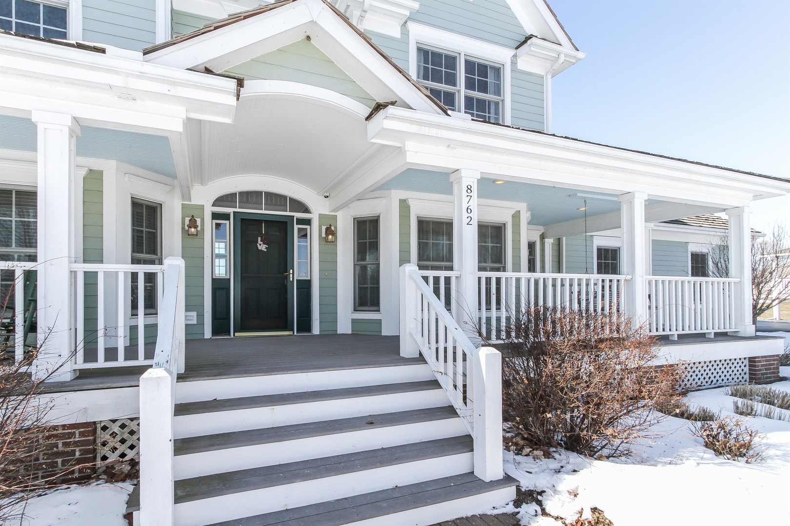 8762 Country Shire Lane Spring Grove, IL 60081 - Photo 2 of 39 a front view of a house with a porch