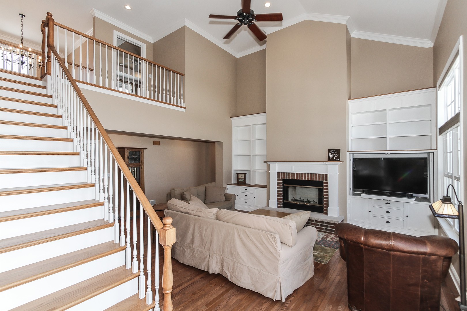 8762 Country Shire Lane Spring Grove, IL 60081 - Photo 16 of 39 a living room with furniture and a fireplace