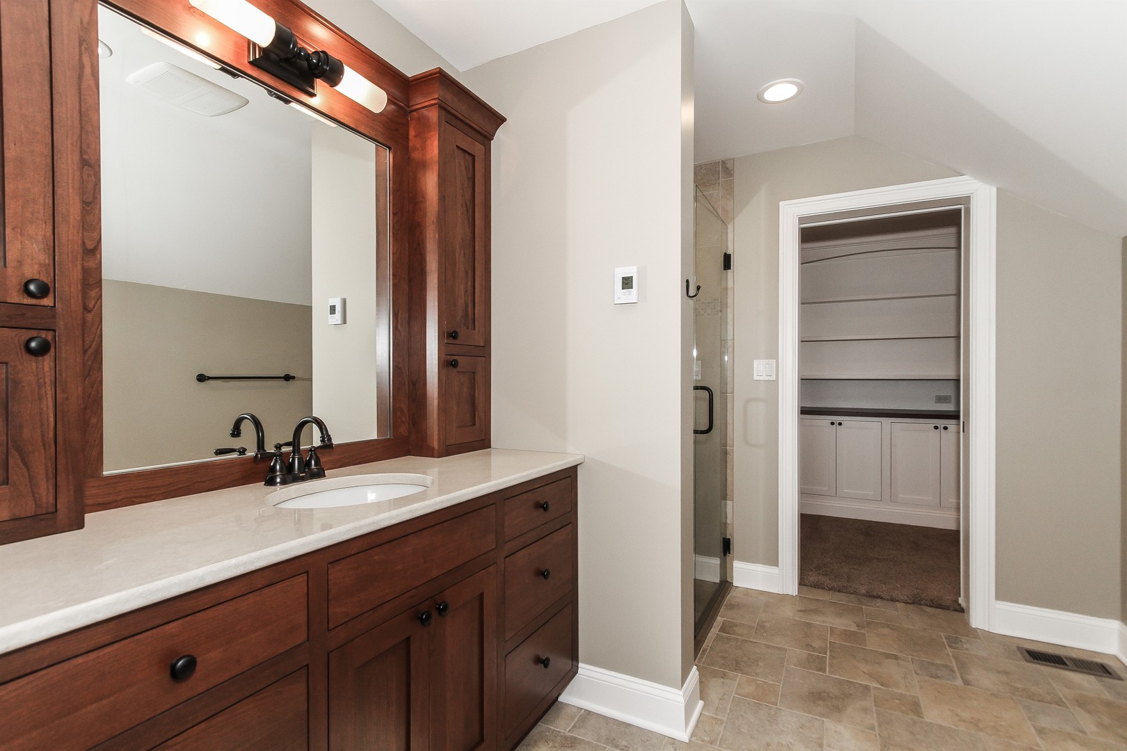 8762 Country Shire Lane Spring Grove, IL 60081 - Photo 19 of 39 a bathroom with a double vanity sink and a mirror