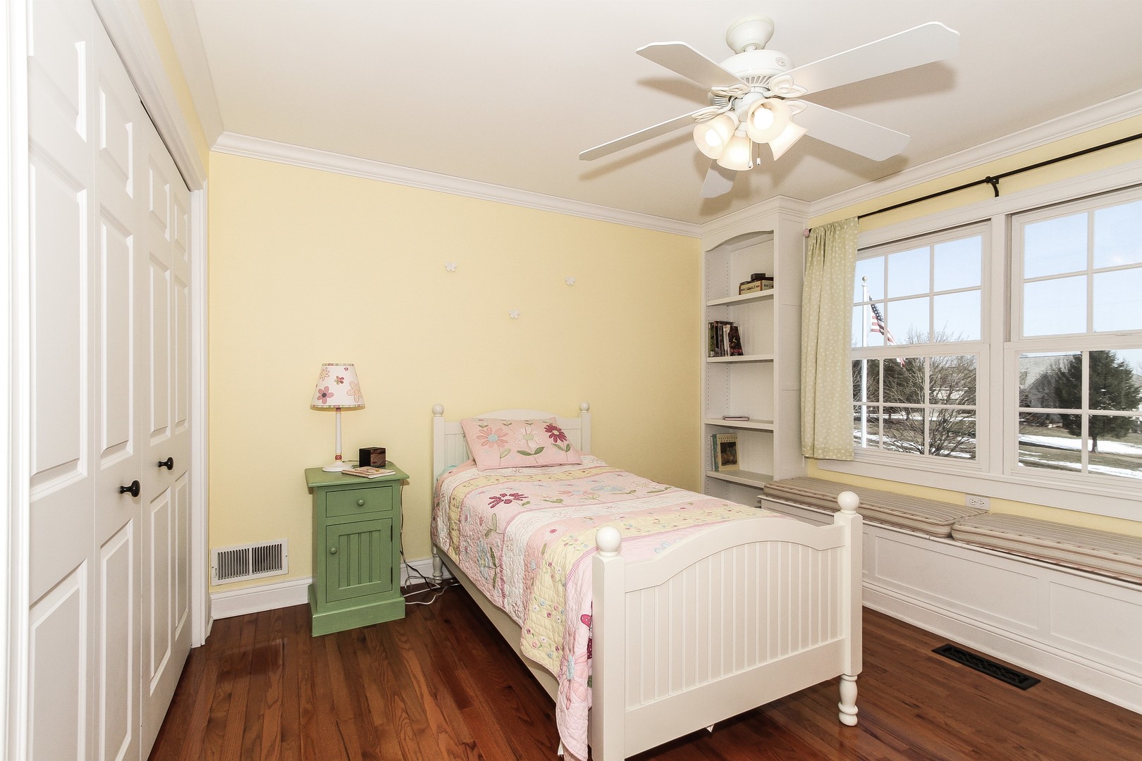 8762 Country Shire Lane Spring Grove, IL 60081 - Photo 24 of 39 a bedroom with a bed and a large window with wooden floor