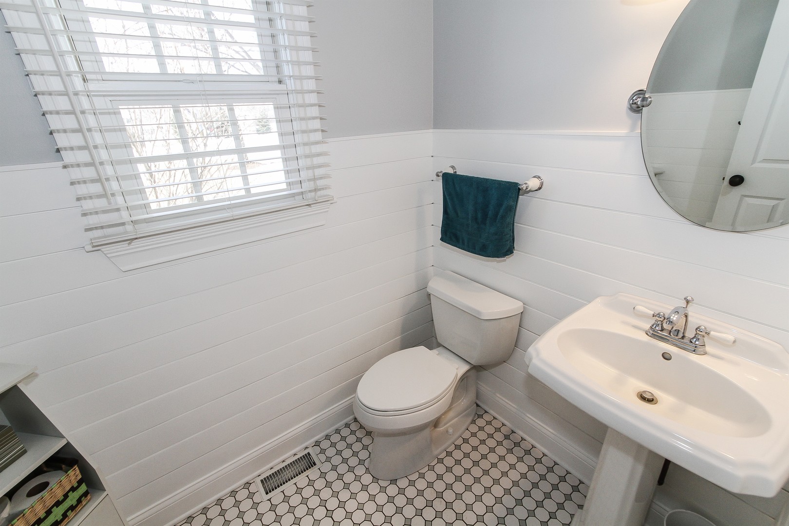 8762 Country Shire Lane Spring Grove, IL 60081 - Photo 28 of 39 a bathroom with a toilet a sink and a window
