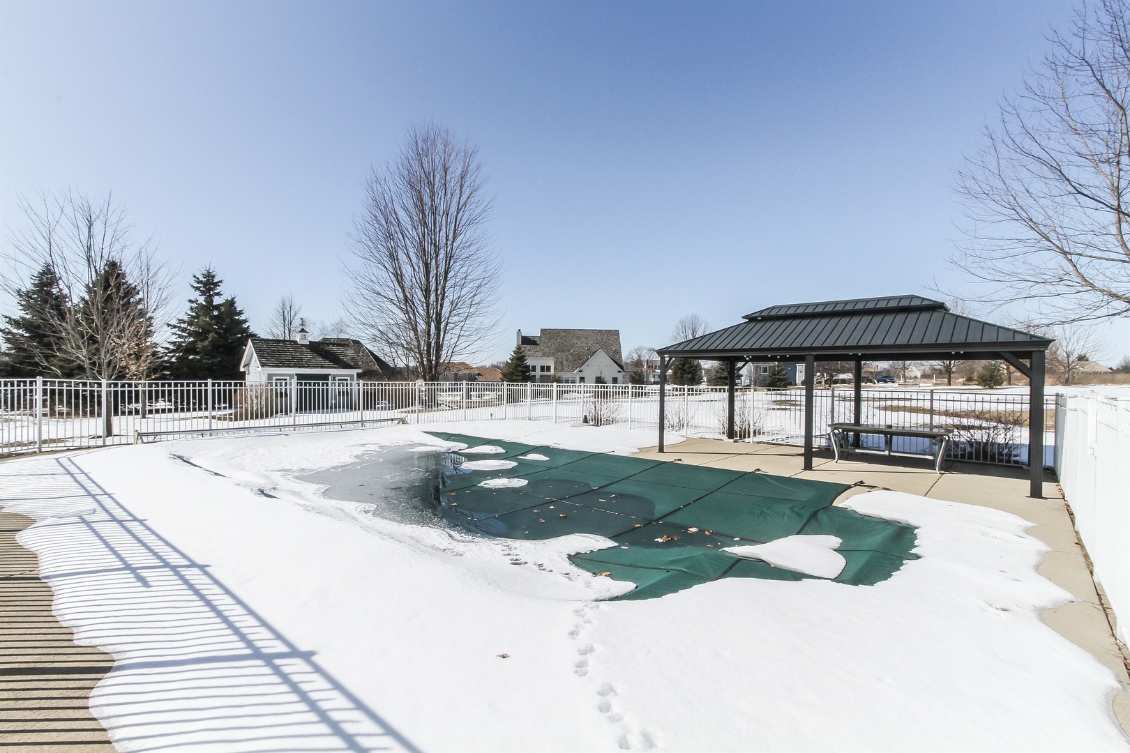 8762 Country Shire Lane Spring Grove, IL 60081 - Photo 32 of 39 a view of a swimming pool with a patio