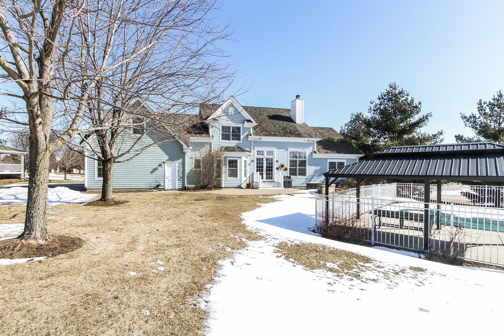 8762 Country Shire Lane Spring Grove, IL 60081 - Photo 33 of 39 a view of a house with a snow on the road