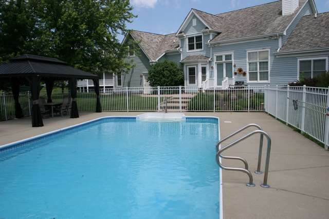8762 Country Shire Lane Spring Grove, IL 60081 - Photo 39 of 39 a view of a house with a swimming pool