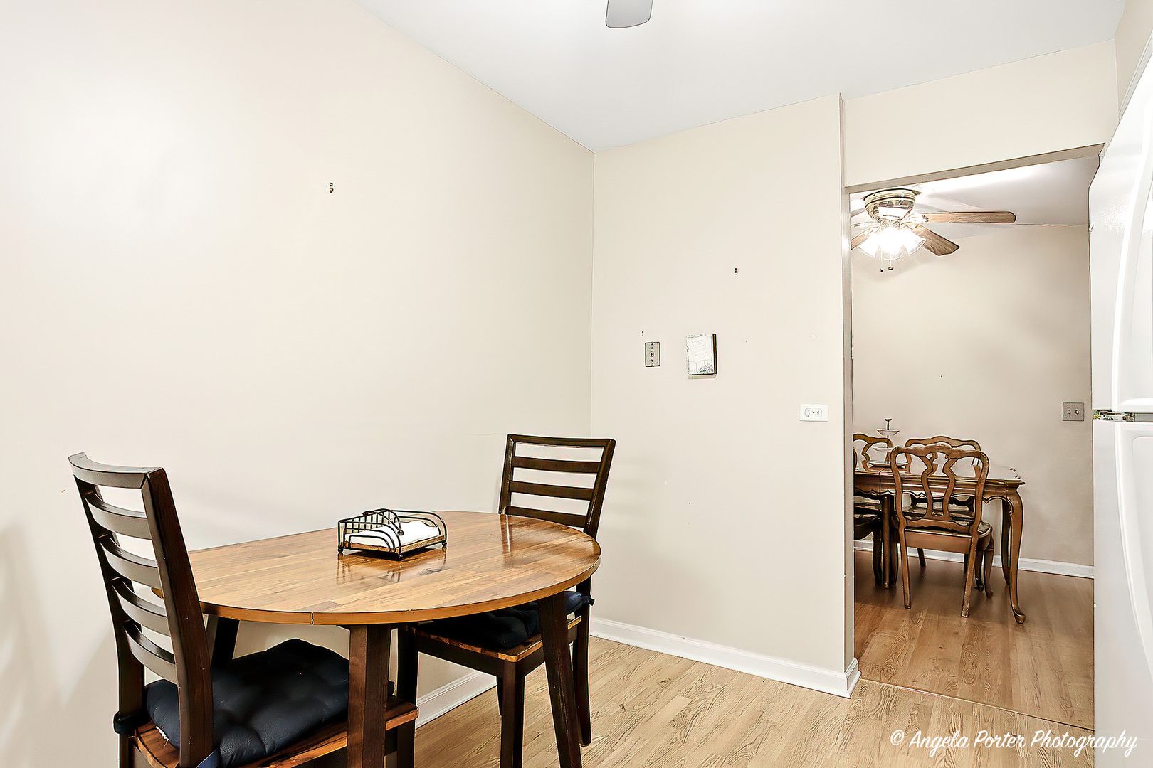 1425 Sandpebble Drive, Unit 227 Wheeling, IL 60090 - Photo 11 of 21 a view of a dining room with furniture and wooden floor