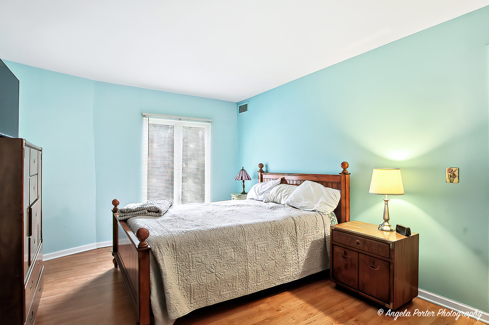 1425 Sandpebble Drive, Unit 227 Wheeling, IL 60090 - Photo 12 of 21 a bedroom with a bed and wooden floor