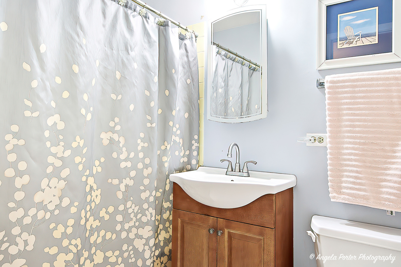 1425 Sandpebble Drive, Unit 227 Wheeling, IL 60090 - Photo 15 of 21 a bathroom with a sink a mirror and a shower curtain