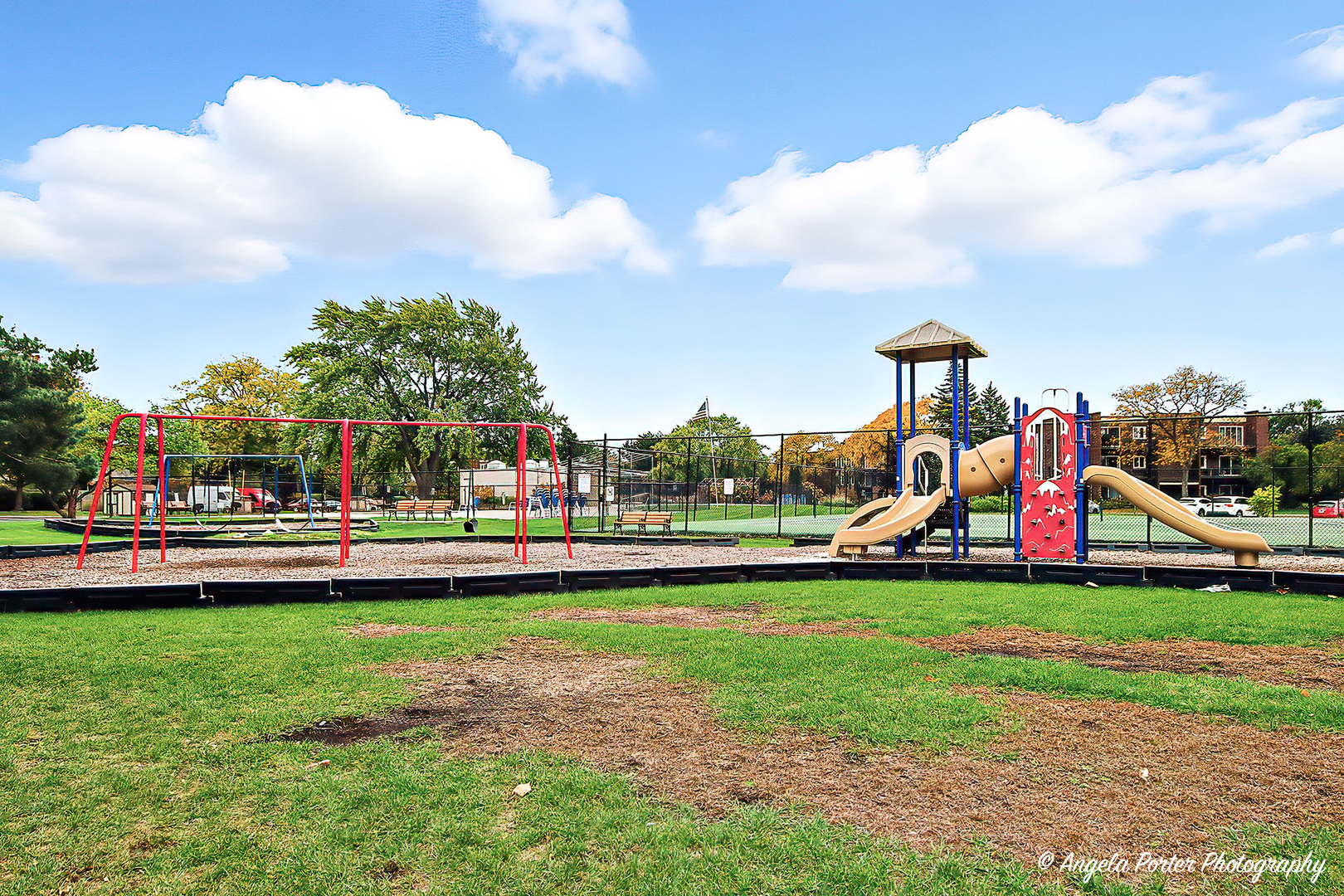 1425 Sandpebble Drive, Unit 227 Wheeling, IL 60090 - Photo 20 of 21 a view of a park with swings and slides