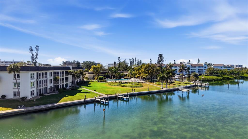 4440 Exeter Drive, Unit 106 Longboat Key, FL 34228 - Photo 24 of 26 a view of a lake with a city
