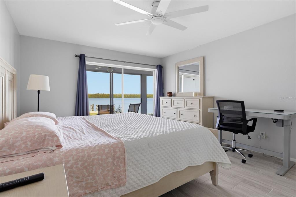 4440 Exeter Drive, Unit 106 Longboat Key, FL 34228 - Photo 10 of 26 a bedroom with a bed and a large window