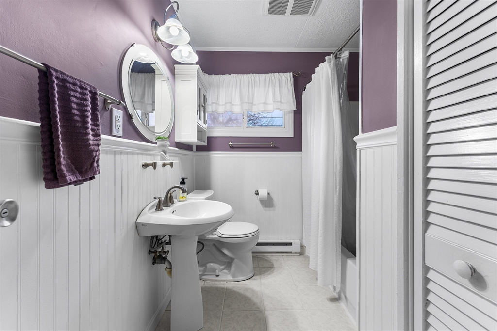 64 Cedar Hill Road Northborough, MA 01532 - Photo 12 of 27 a bathroom with a sink mirror and toilet