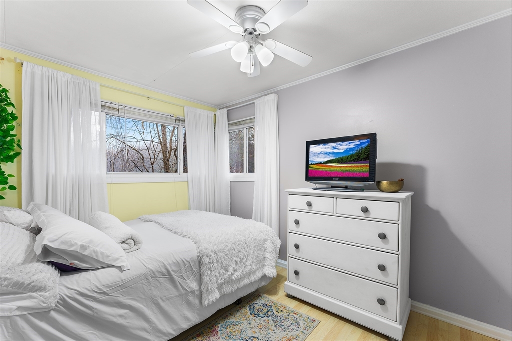64 Cedar Hill Road Northborough, MA 01532 - Photo 15 of 27 a bedroom with a bed and a flat screen tv
