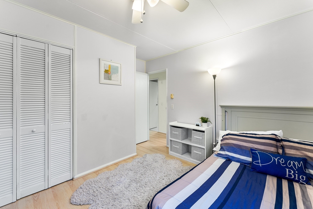 64 Cedar Hill Road Northborough, MA 01532 - Photo 16 of 27 a view of a bedroom with a bed and wooden floor