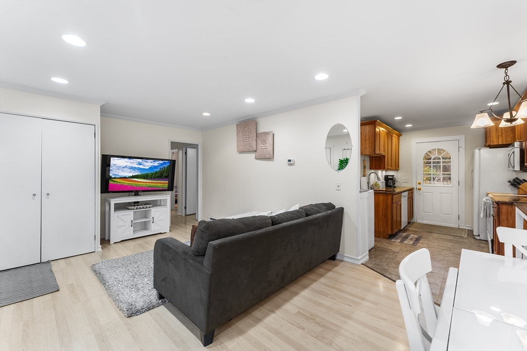64 Cedar Hill Road Northborough, MA 01532 - Photo 5 of 27 a living room with furniture and a flat screen tv