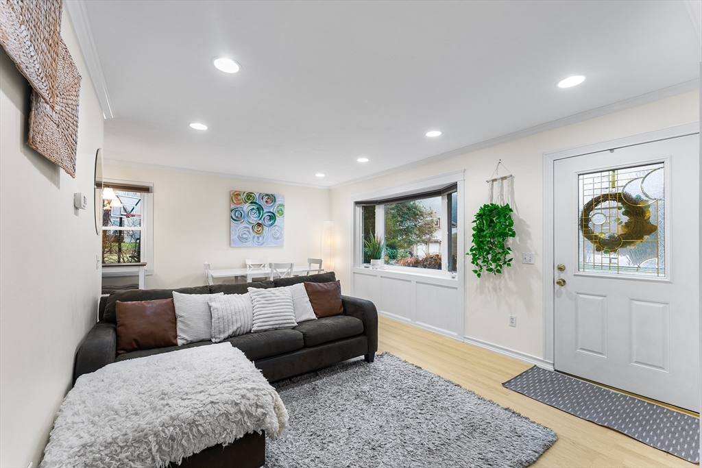 64 Cedar Hill Road Northborough, MA 01532 - Photo 7 of 27 a living room with furniture and a rug