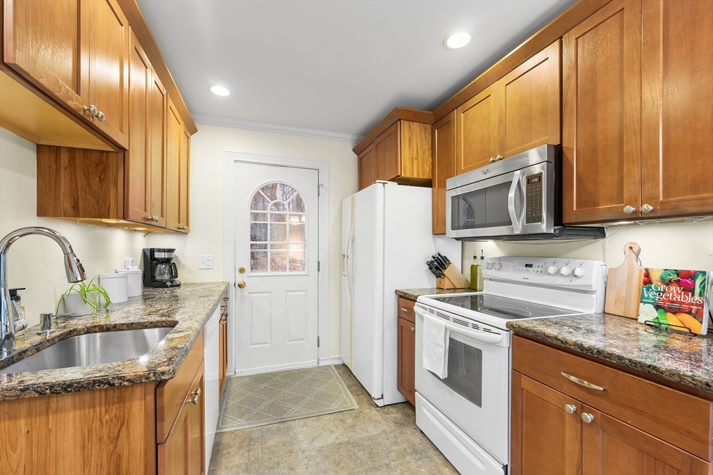 64 Cedar Hill Road Northborough, MA 01532 - Photo 9 of 27 a kitchen with stainless steel appliances granite countertop a stove a sink dishwasher a refrigerator and a microwave