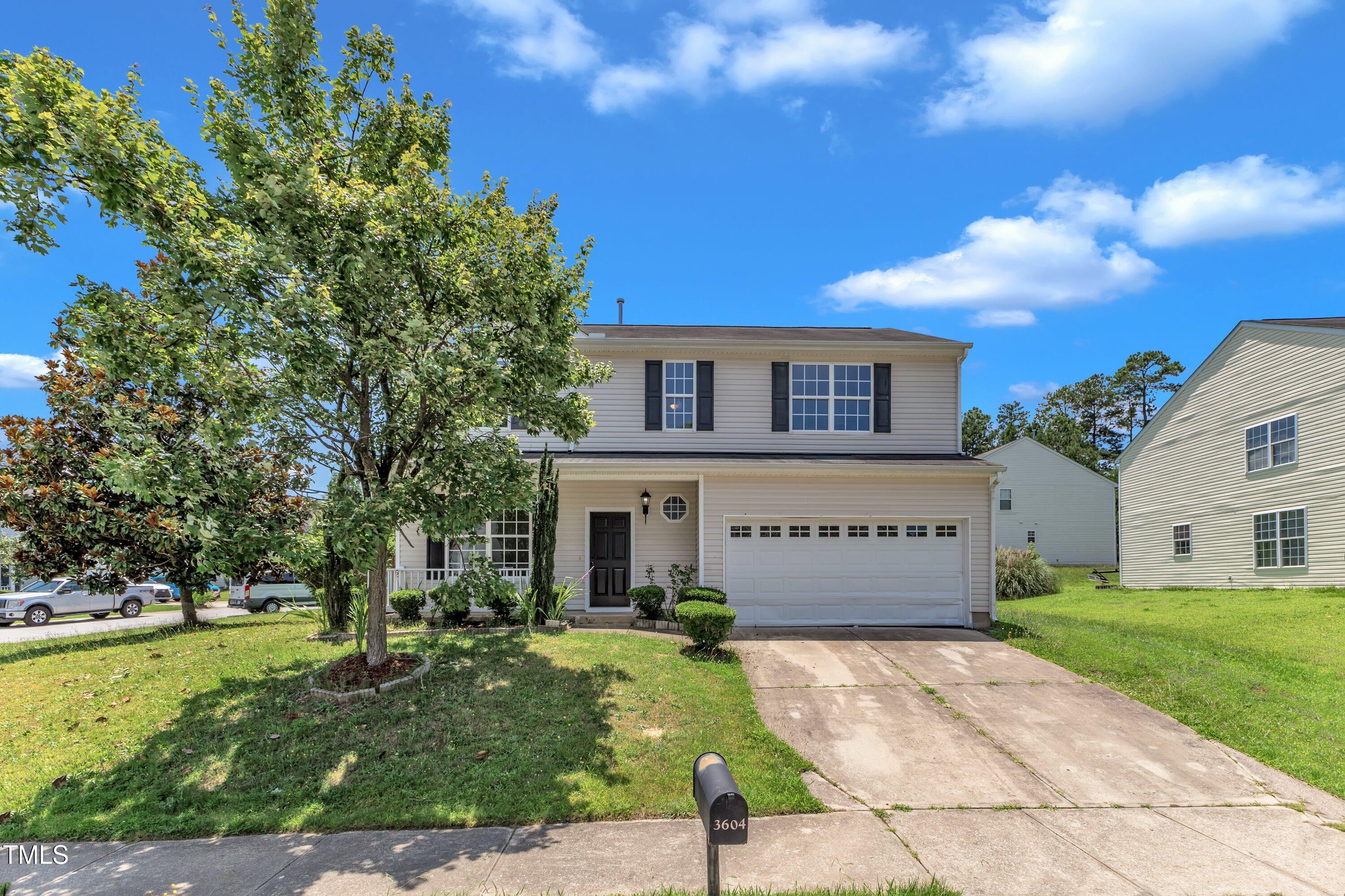 3604 Rivermist Drive Raleigh, NC 27610 - Photo 2 of 48 a front view of a house with garden