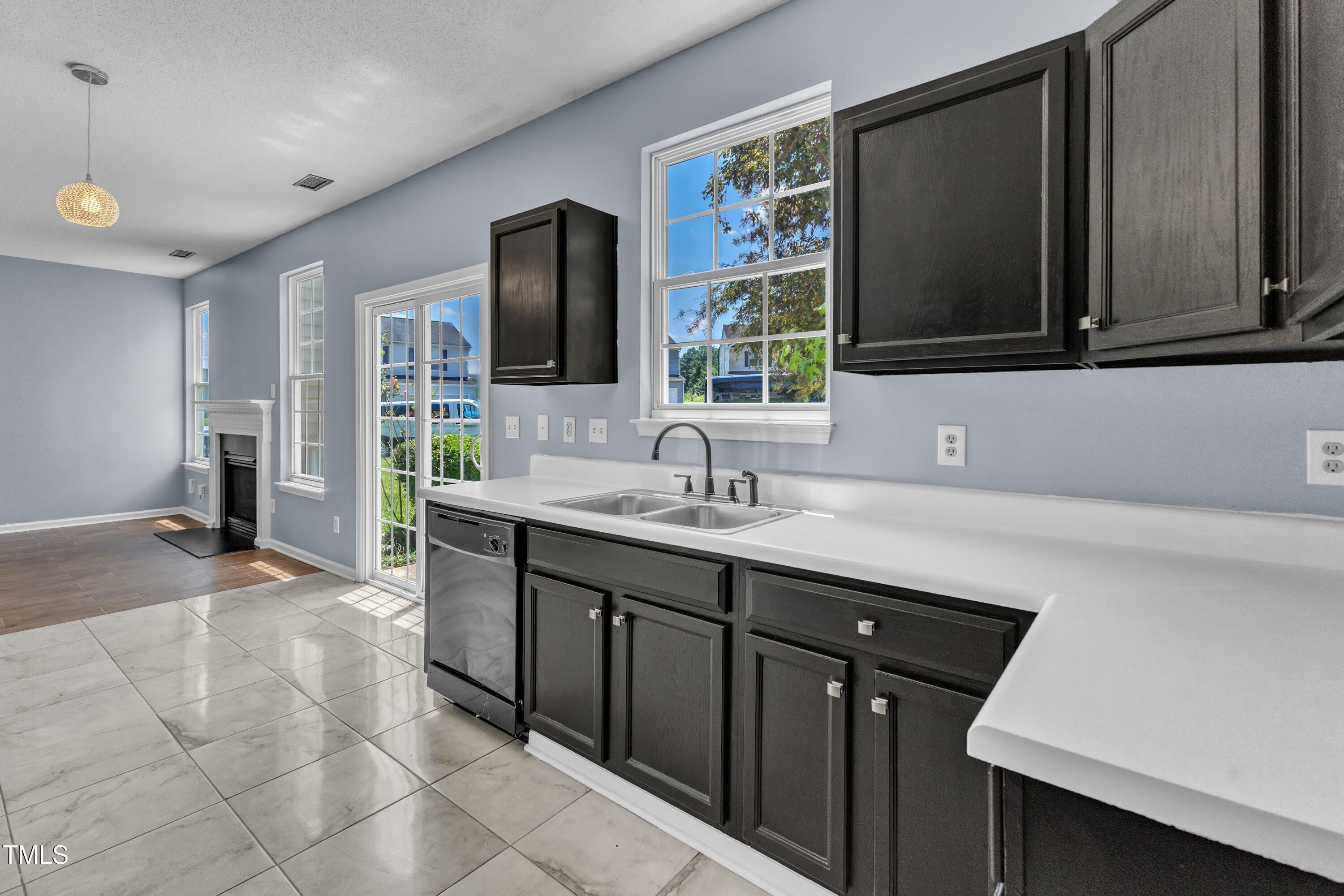 3604 Rivermist Drive Raleigh, NC 27610 - Photo 22 of 48 a bathroom with a sink double vanity granite and a mirror