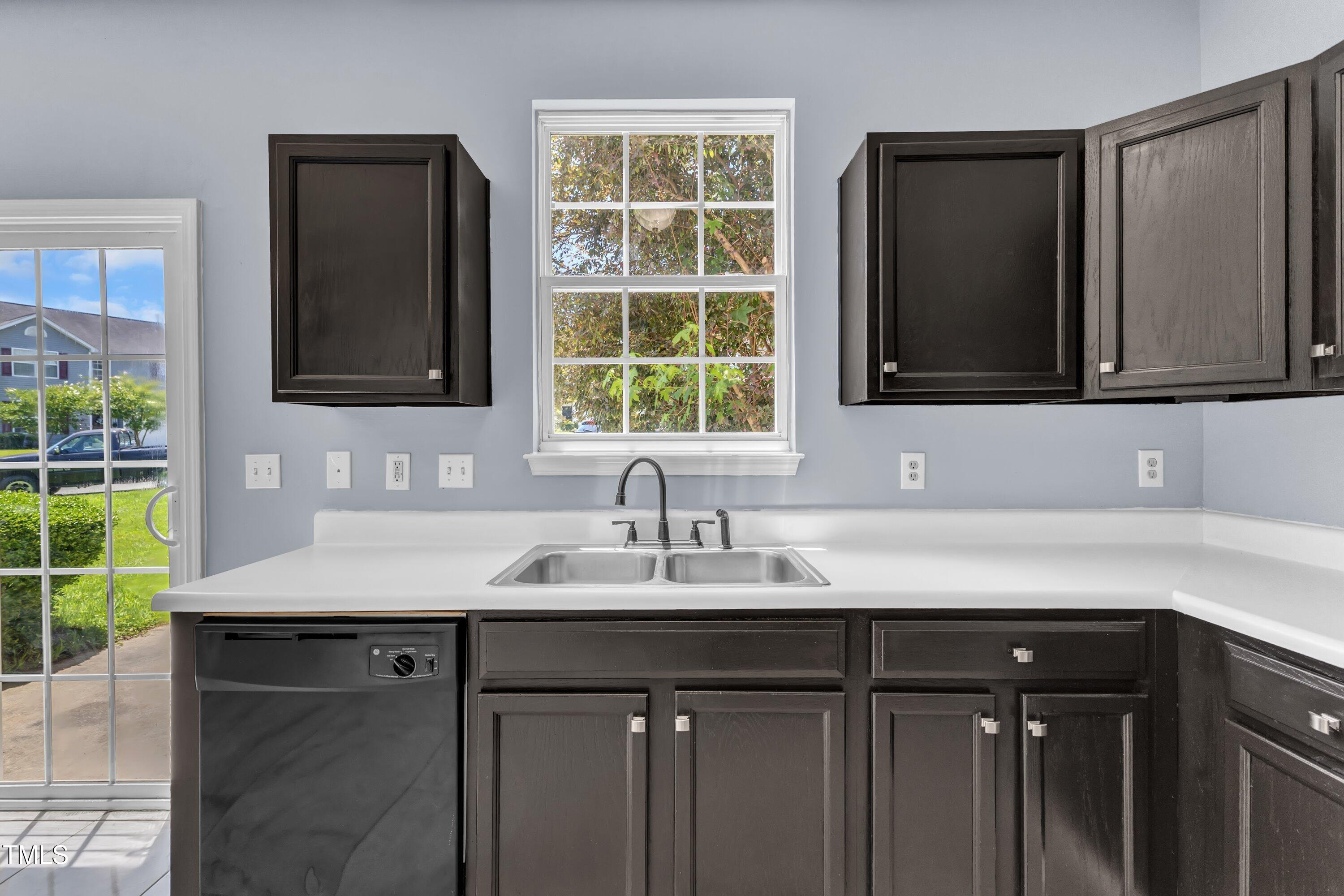 3604 Rivermist Drive Raleigh, NC 27610 - Photo 23 of 48 a sink with a cabinet and mirror