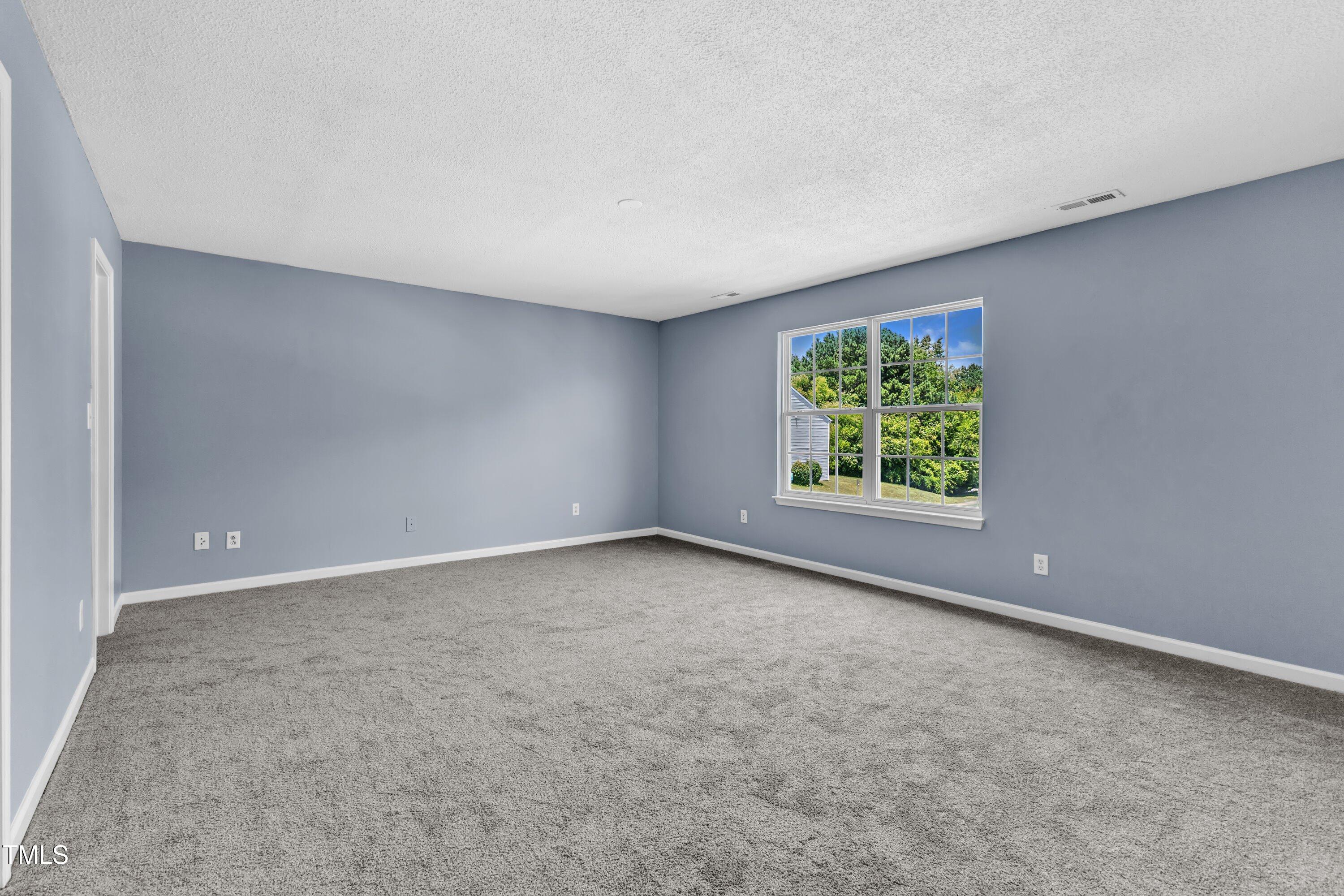 3604 Rivermist Drive Raleigh, NC 27610 - Photo 32 of 48 an empty room with windows