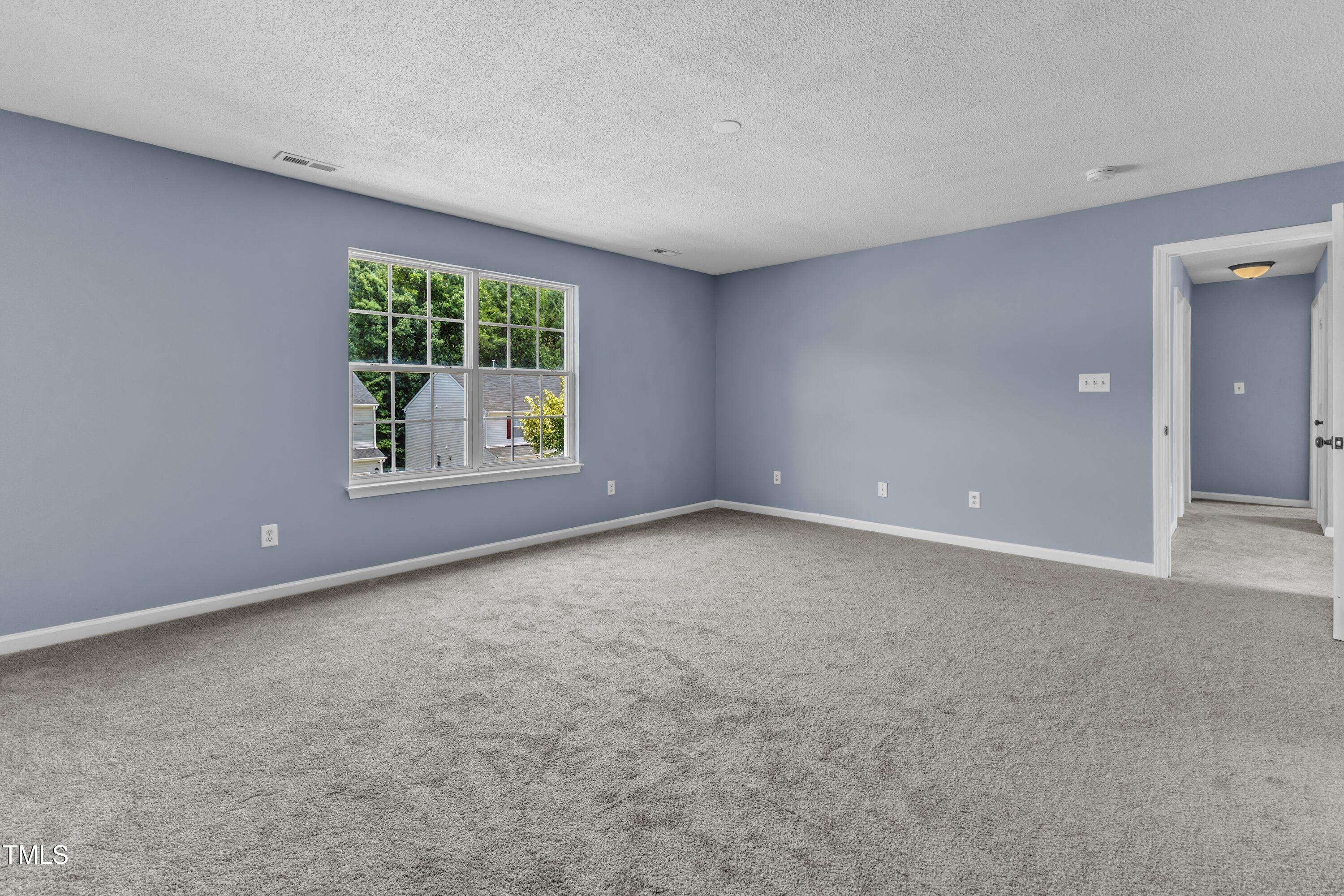 3604 Rivermist Drive Raleigh, NC 27610 - Photo 35 of 48 an empty room with a window