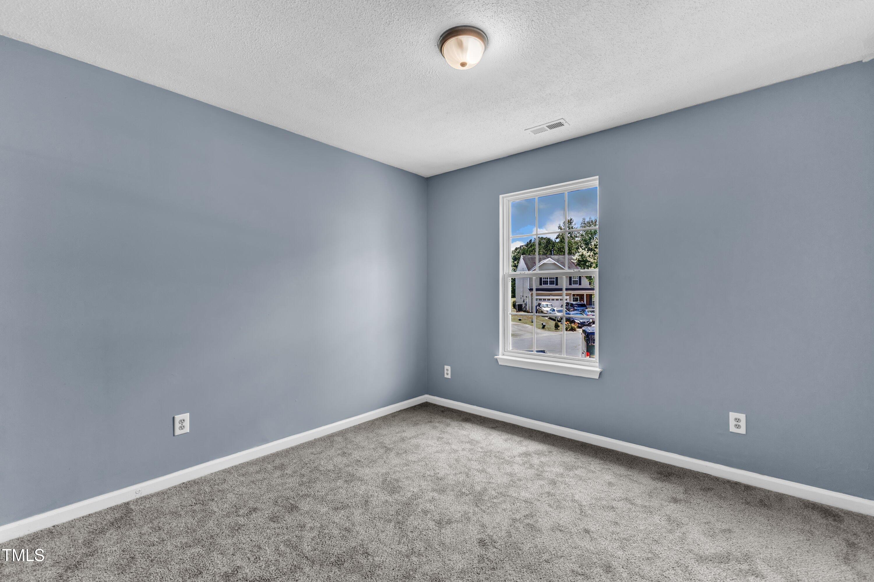 3604 Rivermist Drive Raleigh, NC 27610 - Photo 39 of 48 an empty room with windows