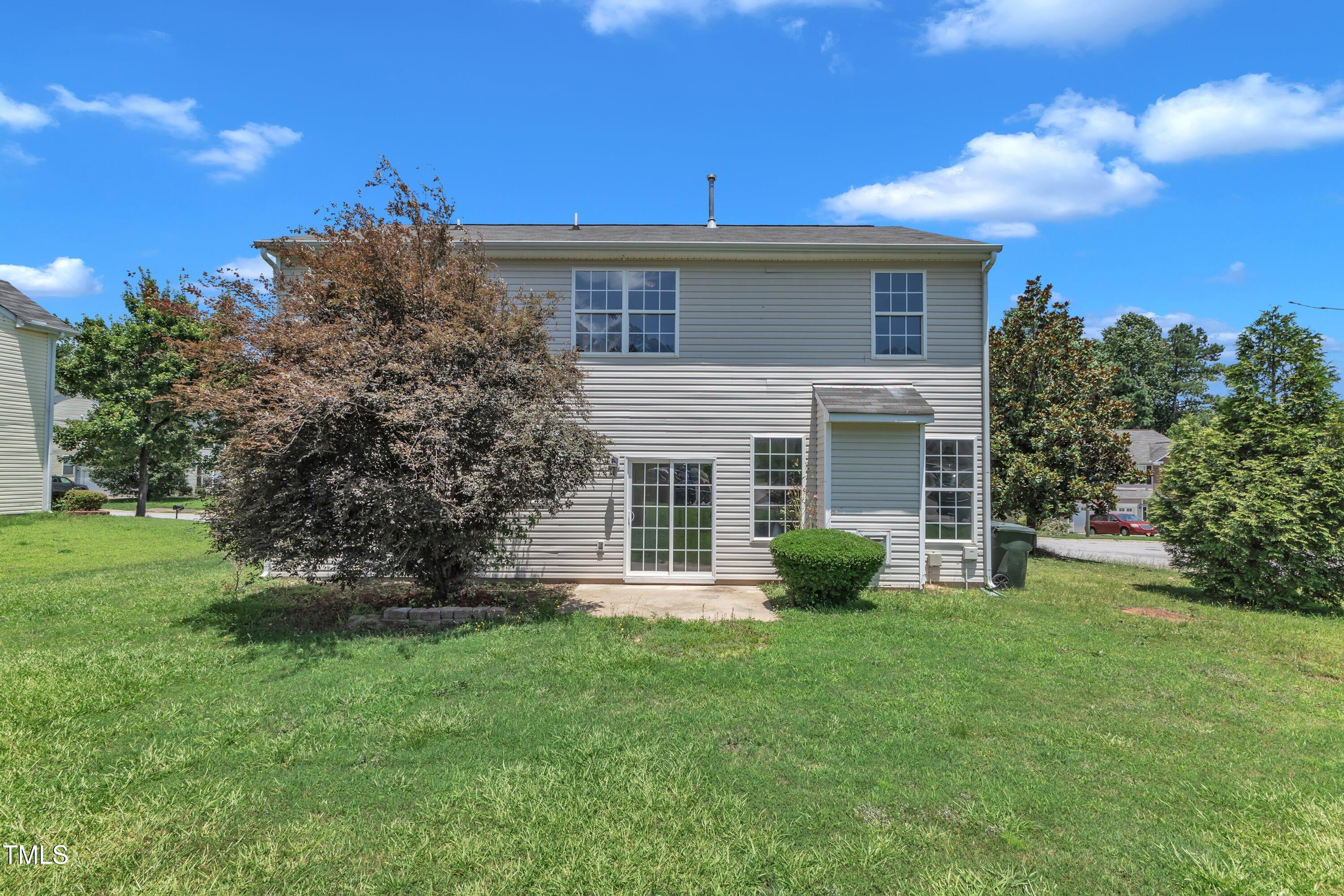 3604 Rivermist Drive Raleigh, NC 27610 - Photo 44 of 48 a view of a house with backyard and garden
