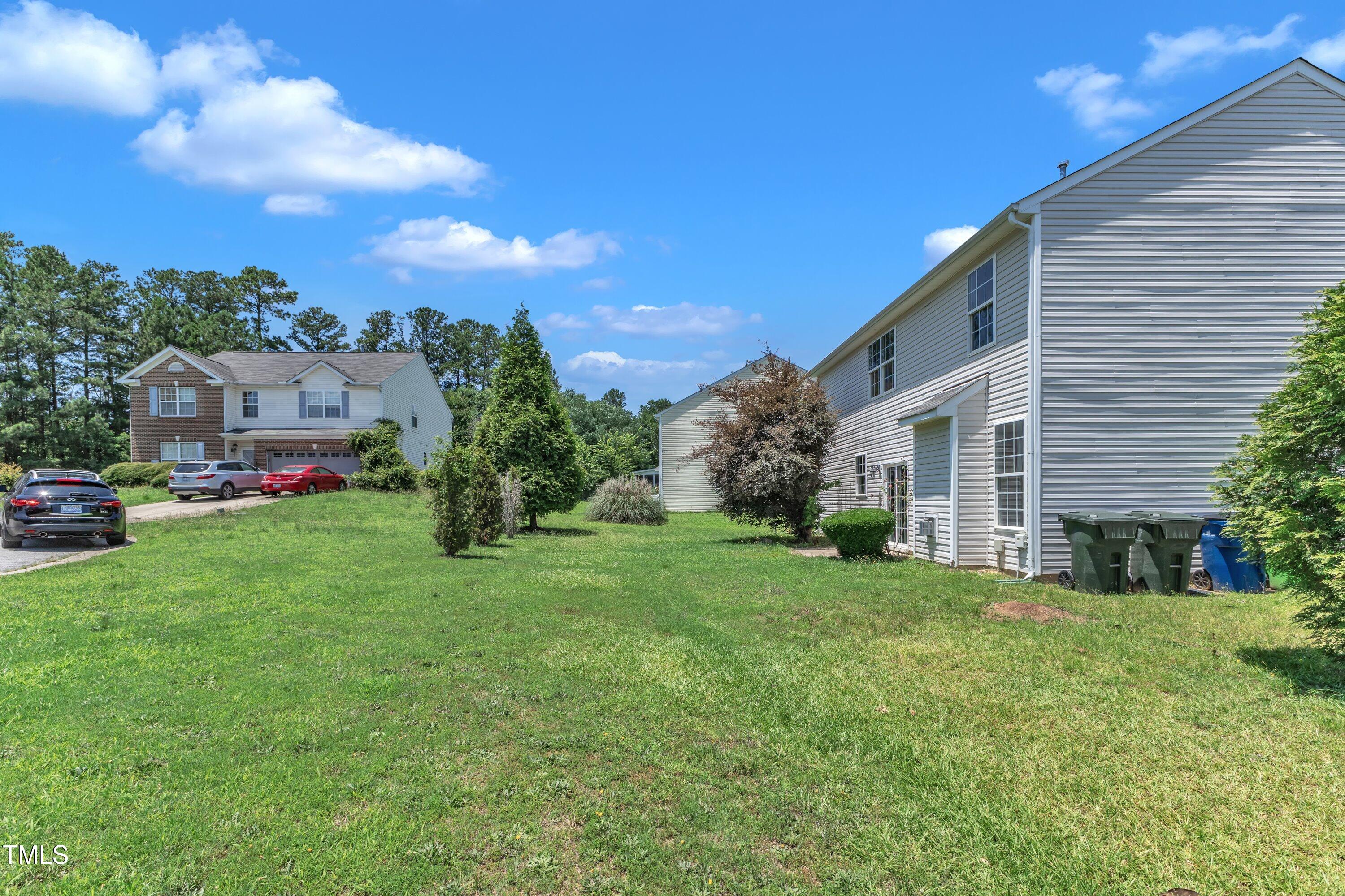 3604 Rivermist Drive Raleigh, NC 27610 - Photo 47 of 48 a view of a house with a back yard