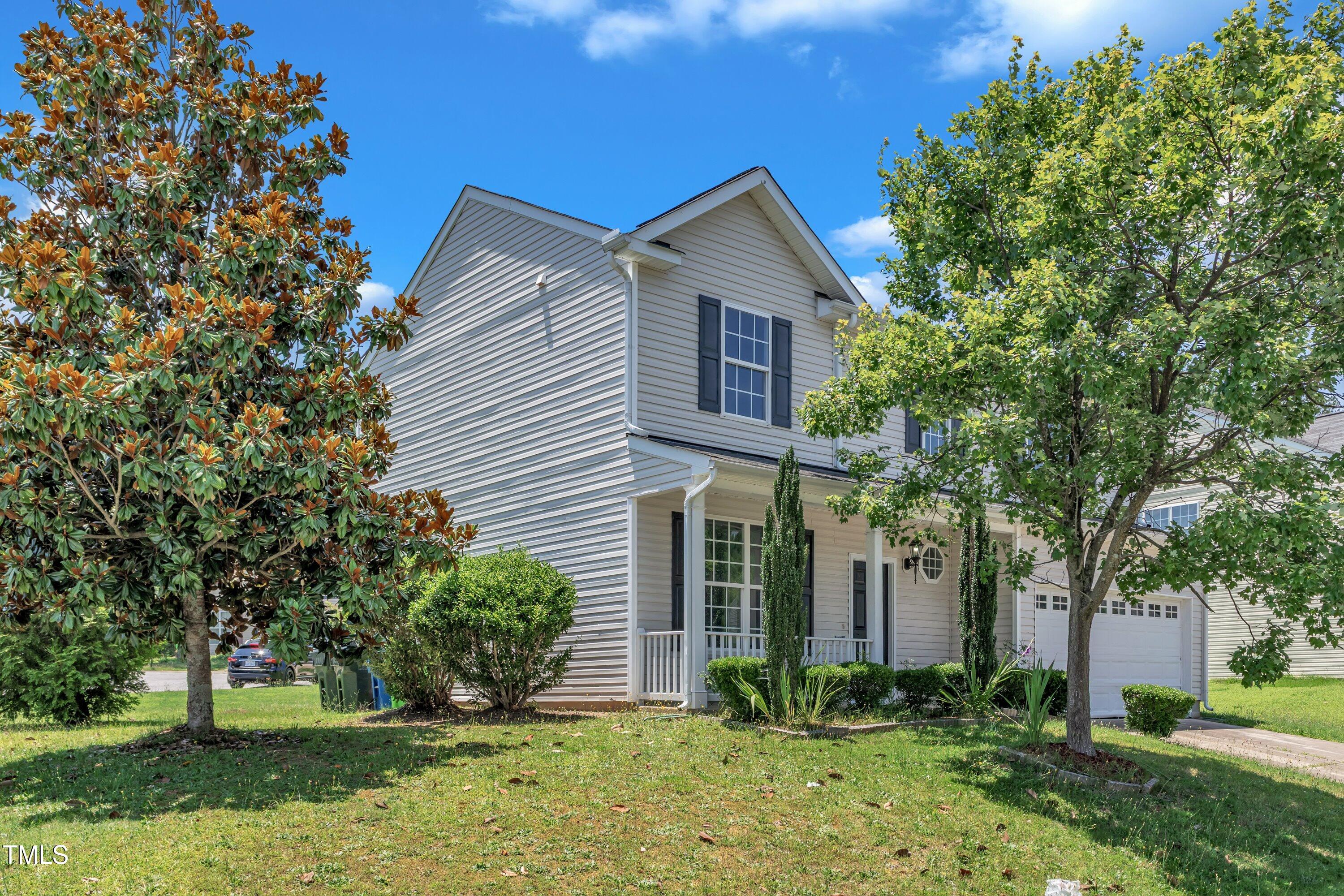 3604 Rivermist Drive Raleigh, NC 27610 - Photo 5 of 48 a front view of a house with garden