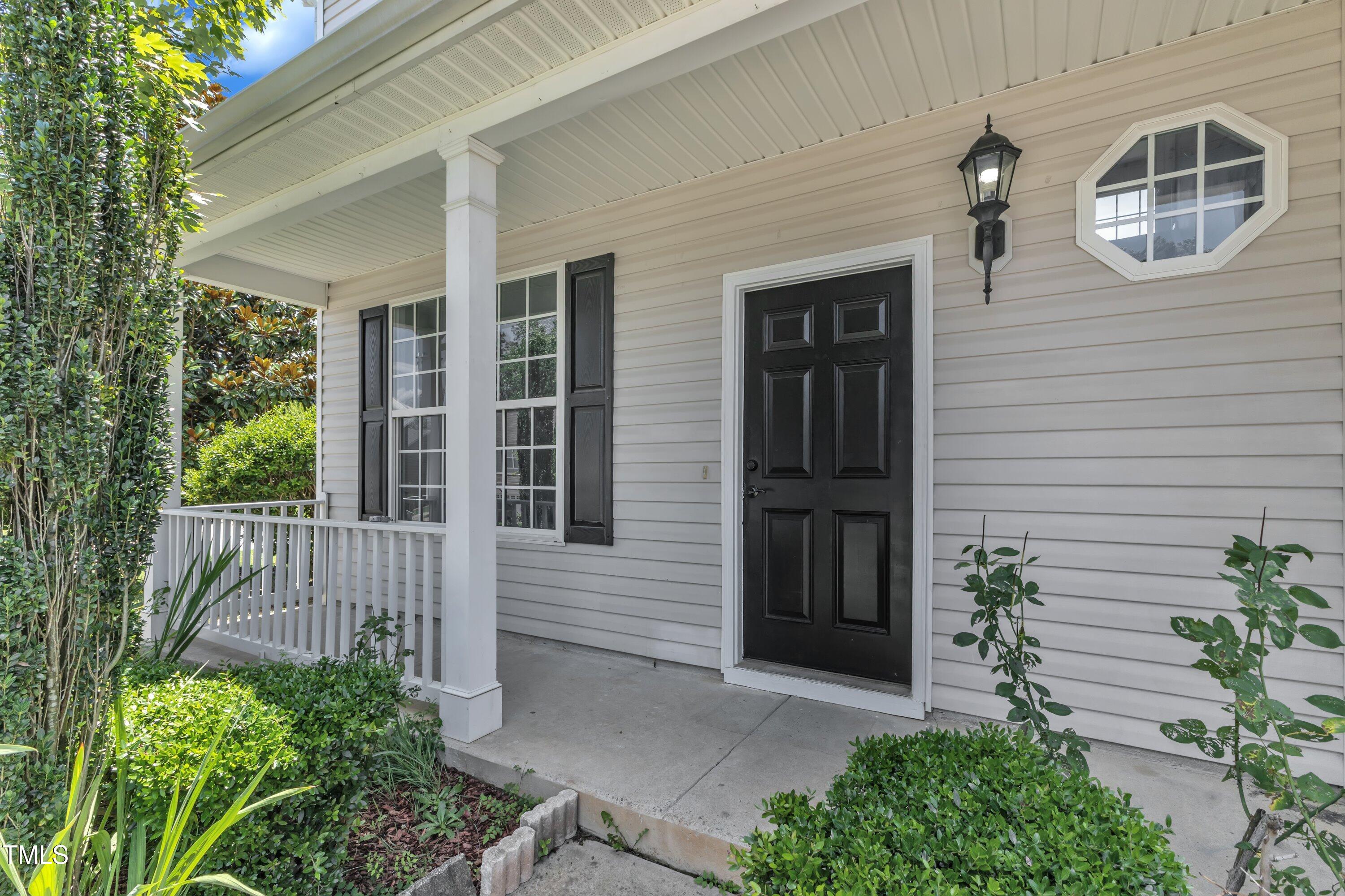 3604 Rivermist Drive Raleigh, NC 27610 - Photo 6 of 48 a front view of a house with a windows