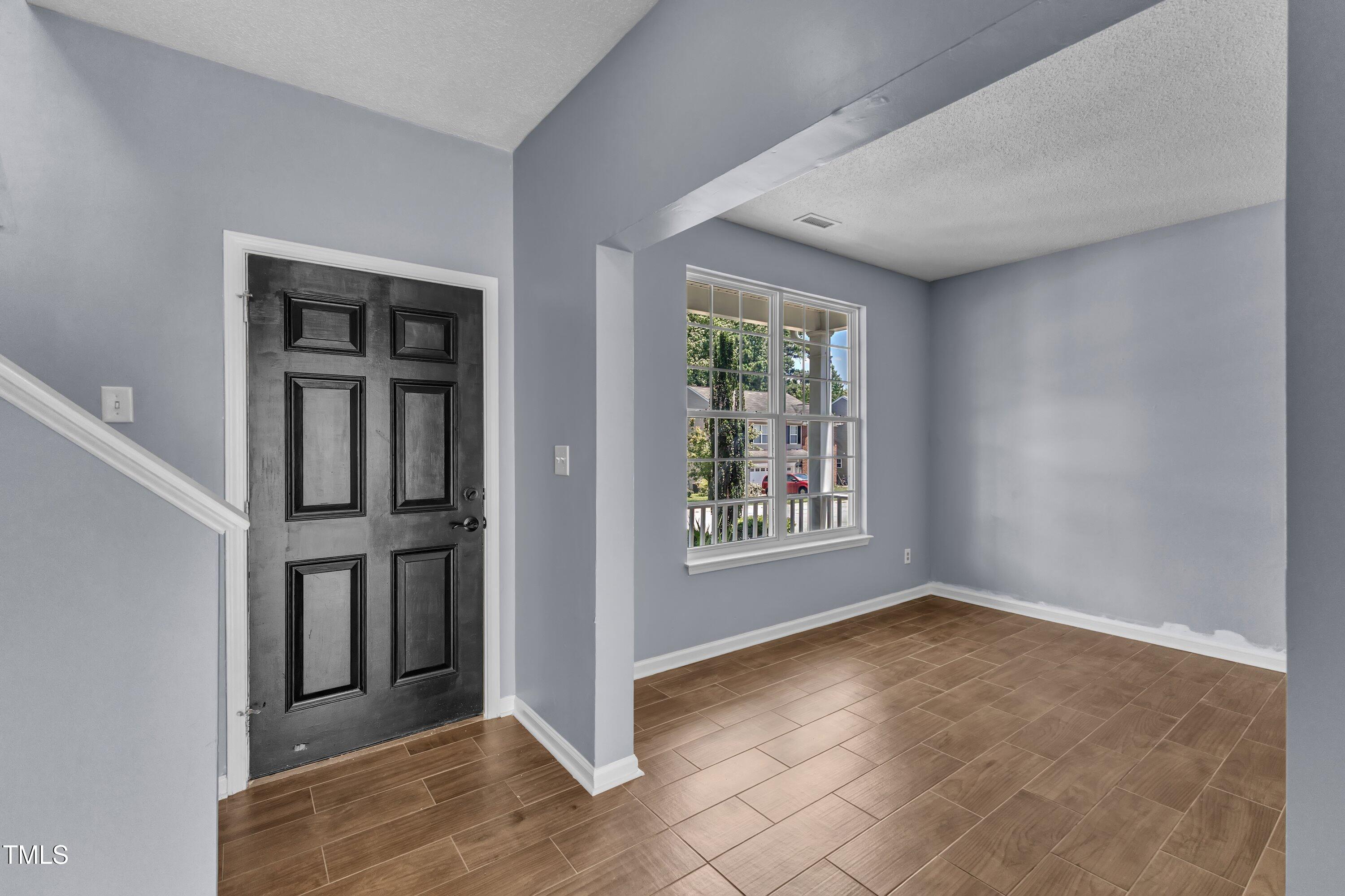 3604 Rivermist Drive Raleigh, NC 27610 - Photo 7 of 48 an empty room with windows