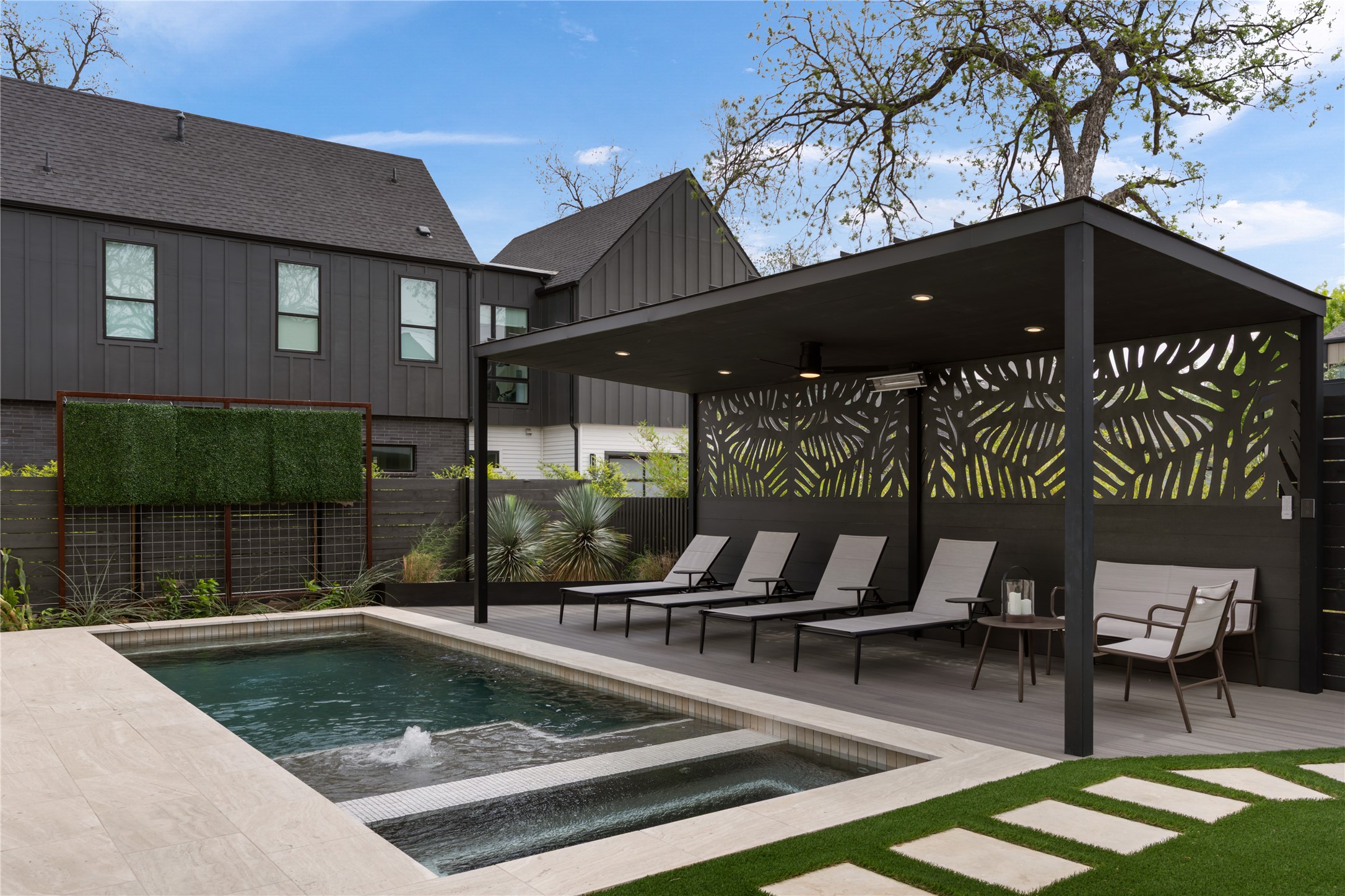 3201 Holton Street Austin, TX 78702 - Photo 32 of 39 A covered poolside cabana with custom laser-cut privacy screens overlooks the pristine pool, offering the ultimate setup for outdoor relaxation.